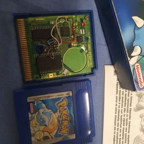 Pokemon Blue cartridge used with special battery-free modification