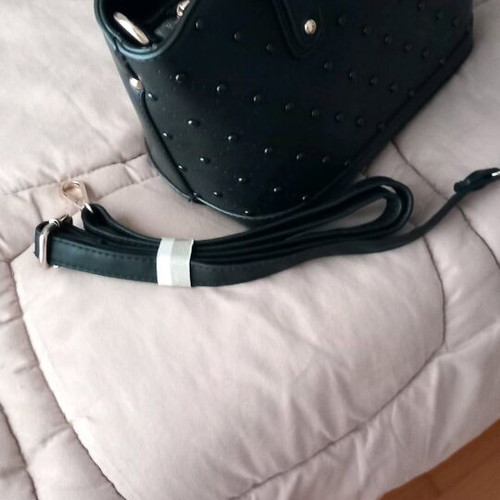 Women's bag used, black handheld with strap and gold details