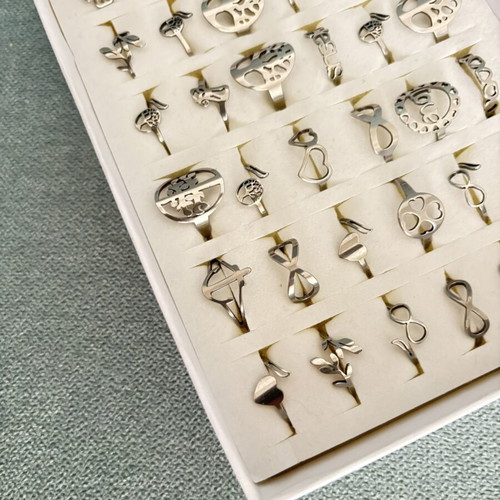 Box of 36 new steel rings with adjustable and fixed sizes