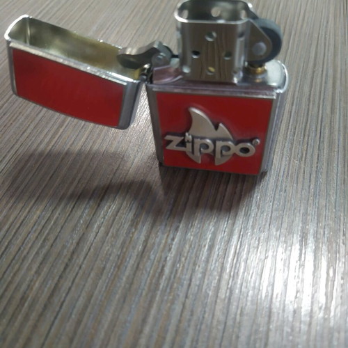 Zippo flame red new with case and replacement stones