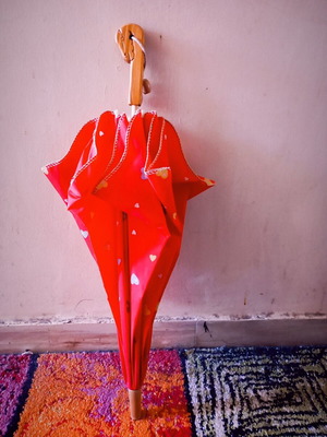 Children's umbrella red with patterns used