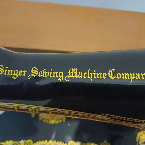 Singer sewing machine with cabinet used, motor and pedal included