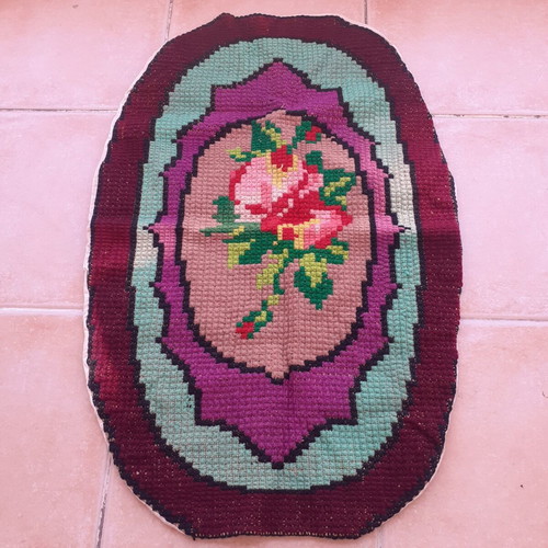 Handmade oval embroidered rug like new