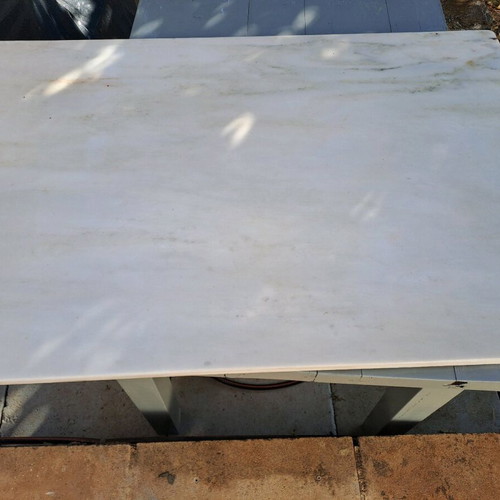 Table with cast iron base and marble used
