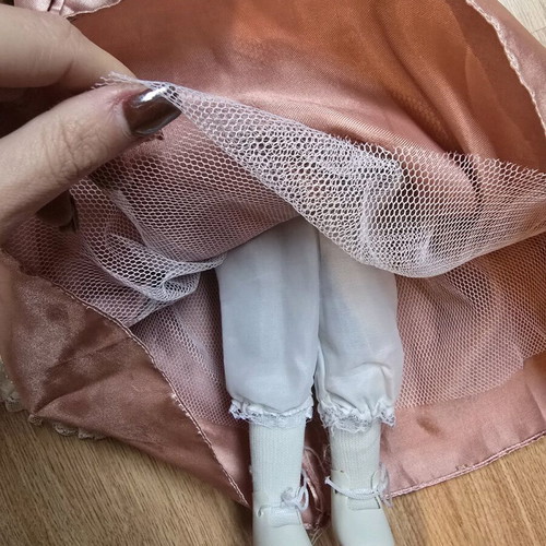 Glass doll like new with satin rotten apple dress and hat
