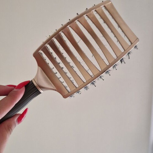 Hair comb with short bristles and openings