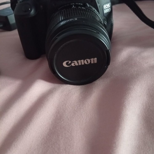Canon EOS600D camera with 18-55mm lens, strap, charger, and two batteries