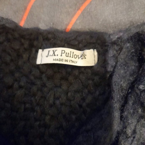 Black women's knitted top with fringes used