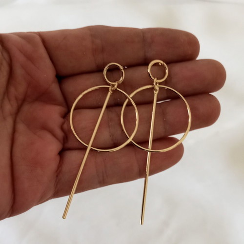 Minimal gold-tone earrings with geometric elements, new