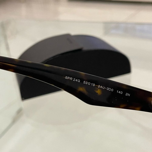 Prada SPR 24Q sunglasses used, brown tortoise design with case