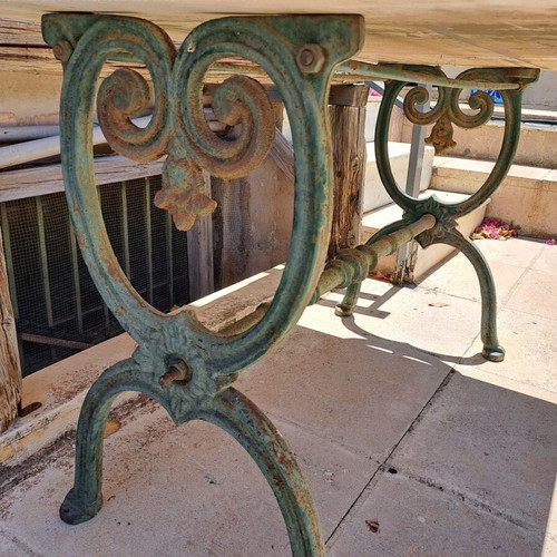 Table with cast iron base and marble used
