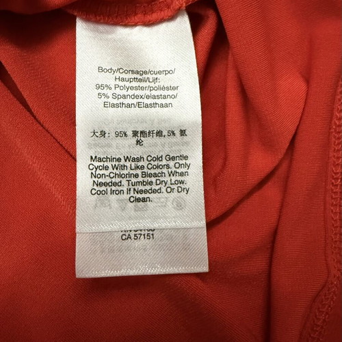DKNY sleeveless blouse with draped wrap design, size M, like new