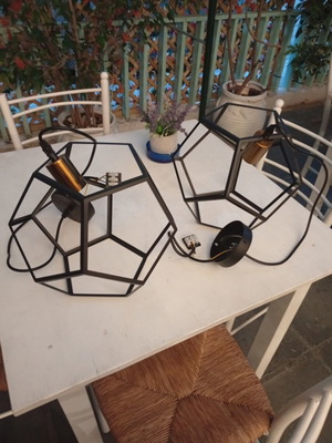 Two rhombic metal ceiling lights