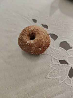 Clay yarn whorl used from Crete