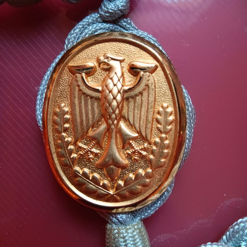 Collectible German uniform shoulder cord badge like new