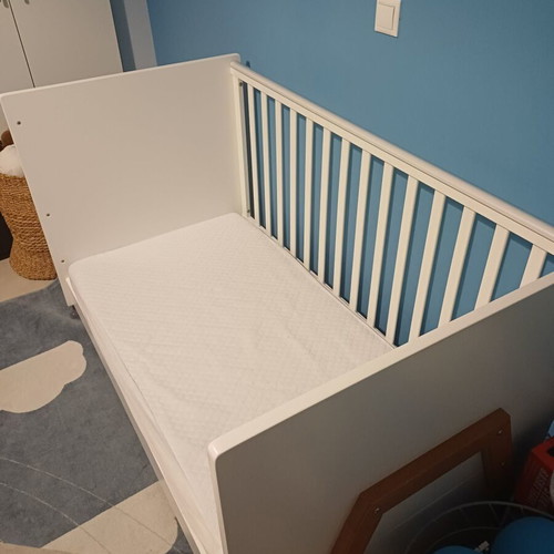 Baby cot with rails, like new, includes mattress and protector