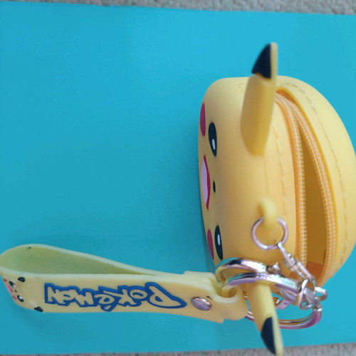 Pokémon keychain wallet used, yellow silicone