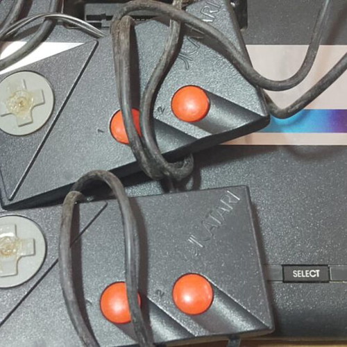 Atari 7800 console used with 2 joysticks and games