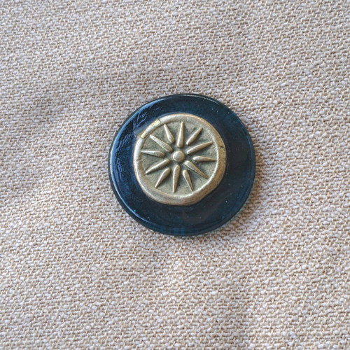 Paperweight with Vergina Star used, brass on glass base