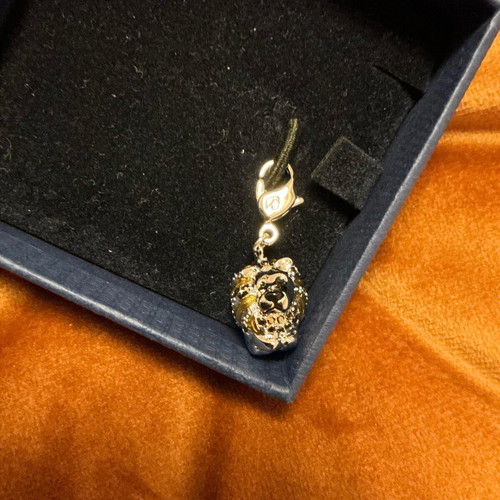Swarovski lion charm like new, silver and gold