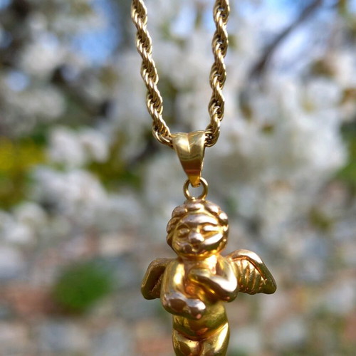 Cherub Angel Charm 18 K pendant like new, gold color