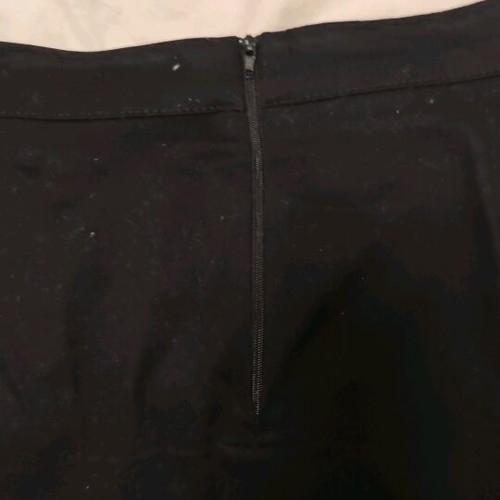Mini black skirt with gold buttons and crown design, like new, size Large Anel