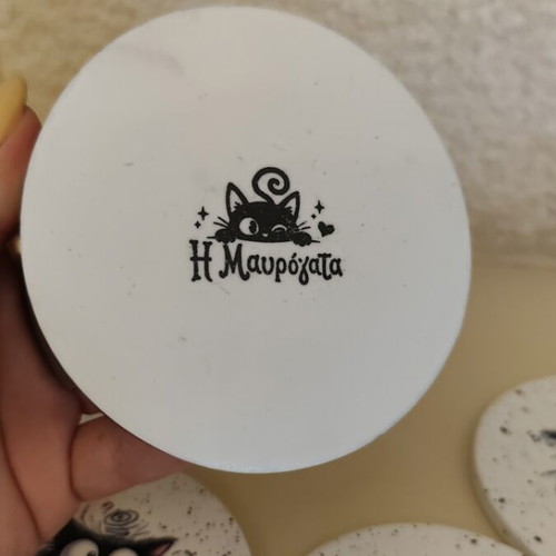 Handmade coasters with black base and 4 playful cat designs