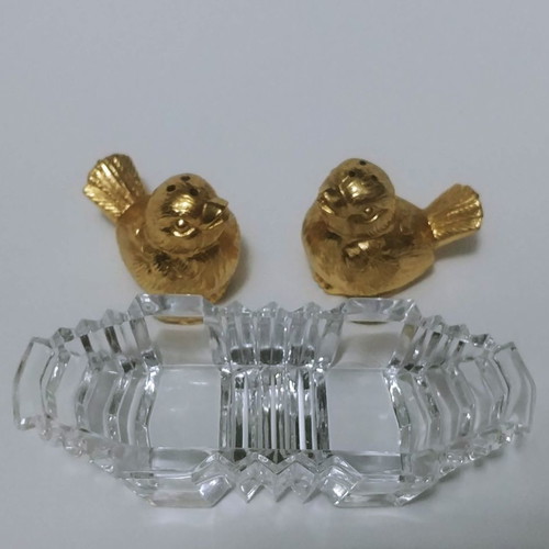 Set of gilded miniature salt and pepper shakers with lead tray