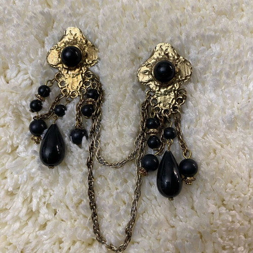 Vintage double brooch like new, gold color with black stones