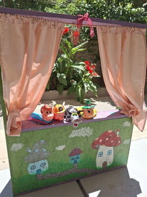 Handmade wooden puppet theater with hand-painted details and puppets like new
