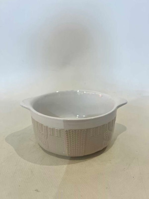 Vicko ceramic bowl used with embossed beige design
