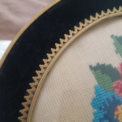 Vintage handmade cross-stitch frame with velvet oval border used