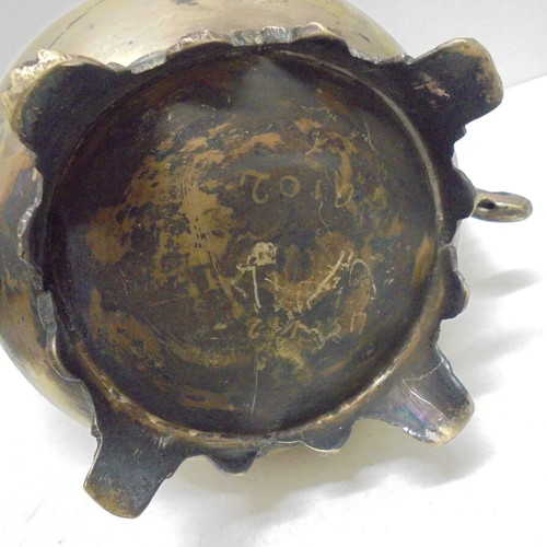 Old bronze teapot with decorative ornaments