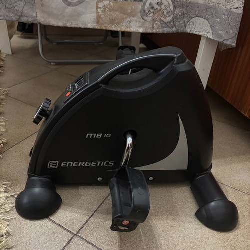 Exercise bike used for physiotherapy with adjustable pedals