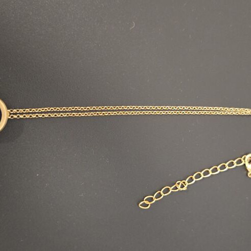 Long necklace with green charm like new