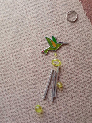 Hanging decorative wind chime with green bird design like new