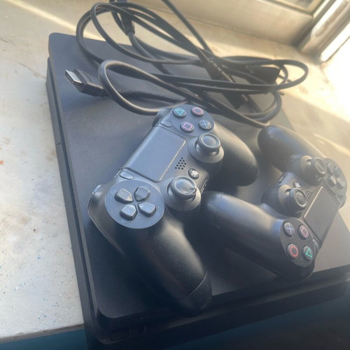 PlayStation 4 (PS4) like new with 2 controllers