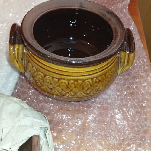 Traditional ceramic clay pot with lid and side handles