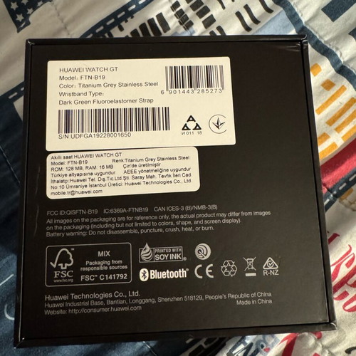 Huawei GT smartwatch used with charging base and fabric straps