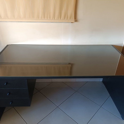 Black handmade wooden desk with glass top and 3 drawers
