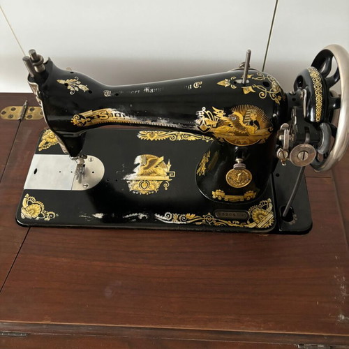 Singer sewing machine in carved furniture used, antique