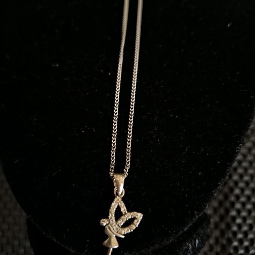 Silver 925 necklace like new with fairy pendant and clear stones