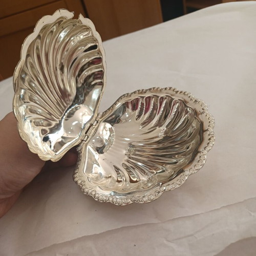 Vintage shell-shaped serving dish used with wear marks