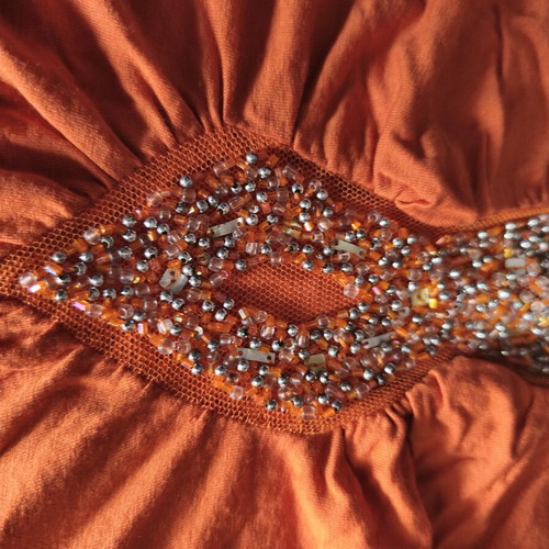Orange blouse with embroidered beads, like new