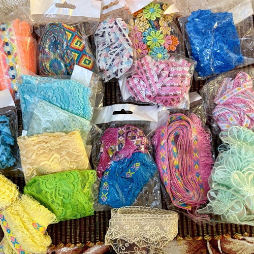 Decorative ribbons, cords, lace and craft elements like new