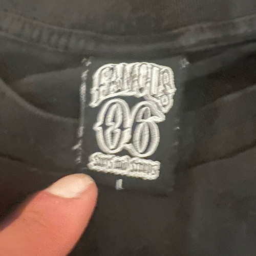 Famous 06 T-shirt used, size large, black cut-sleeve