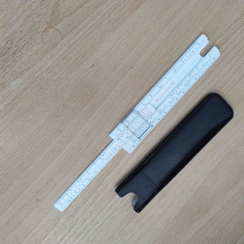 Logarithmic slide rule with case