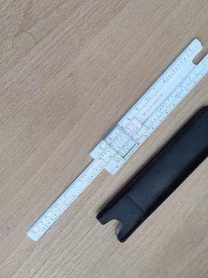 Logarithmic slide rule with case