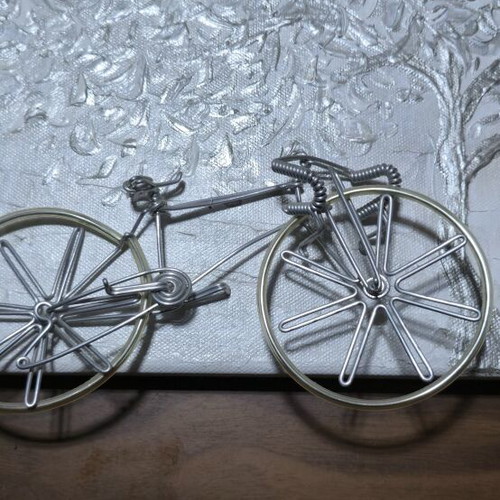 Embossed canvas painting with silver tree and metal bicycle like new