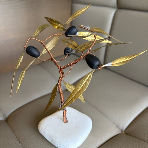 Handmade olive decoration on marble base used